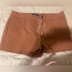 Dust pink colored express shorts. Size 12